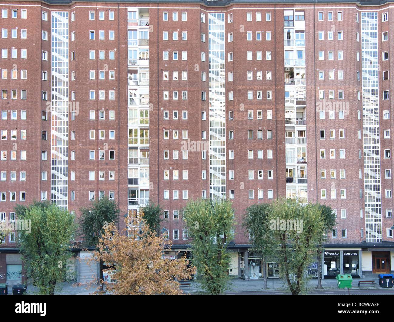 Symmetrical Red Brick Apartment Building Facade - Full frontal view of ...