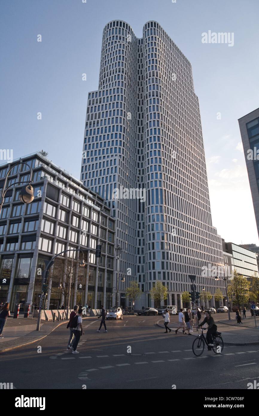 Modern architecture in City West, Berlin - The Upper West tower, a striking example of modern architecture, with street life and traffic creating a vi Stock Photo