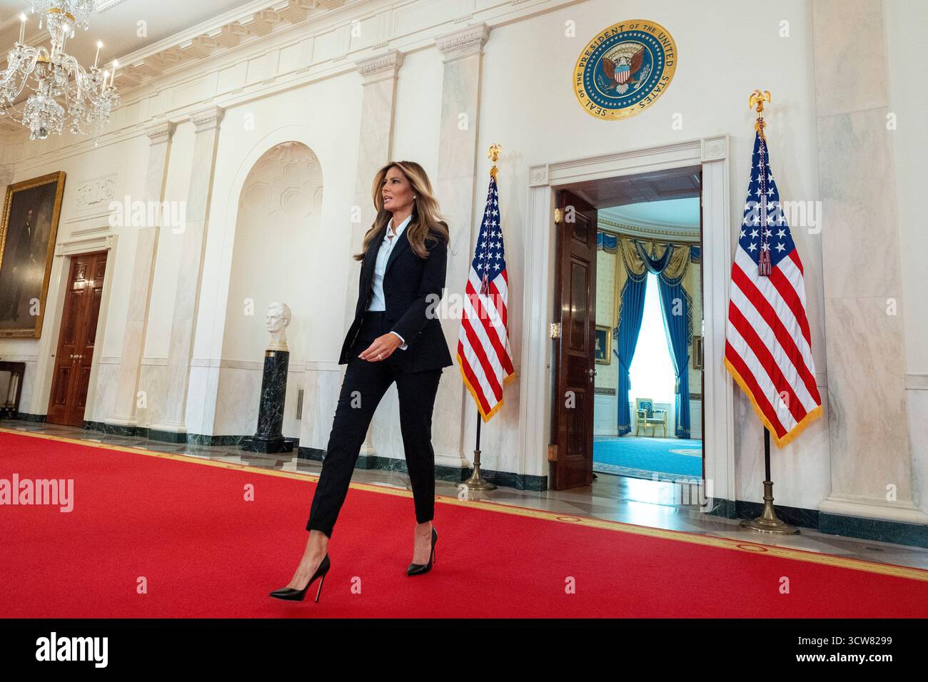 First lady Melania Trump arrives to speak in the Grand Foyer of the ...