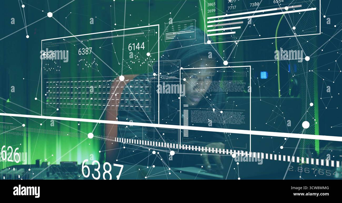 Monitoring adult IT specialist typing code at data center, with ...
