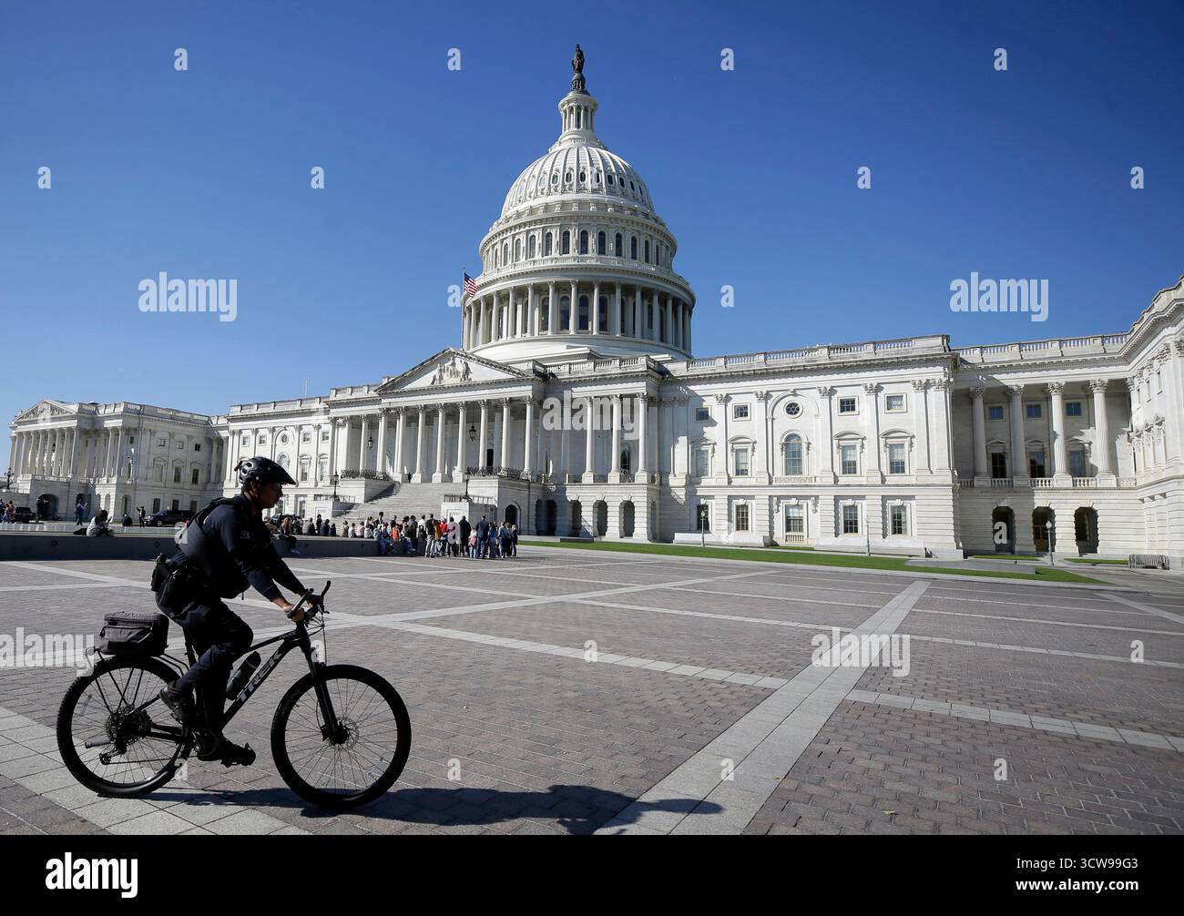 U.S. Capitol Police officer patrols in front of the U.S. Capitol ...
