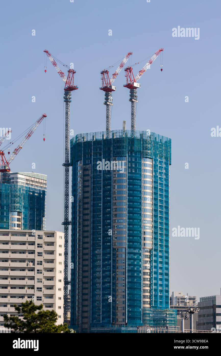 Urban development showing a new high-rise building being built in a modern city Stock Photo