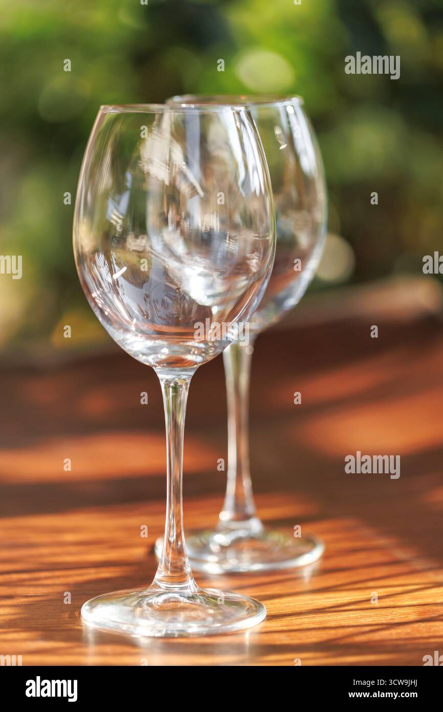 Clear glasses reflecting greenery Stock Photo