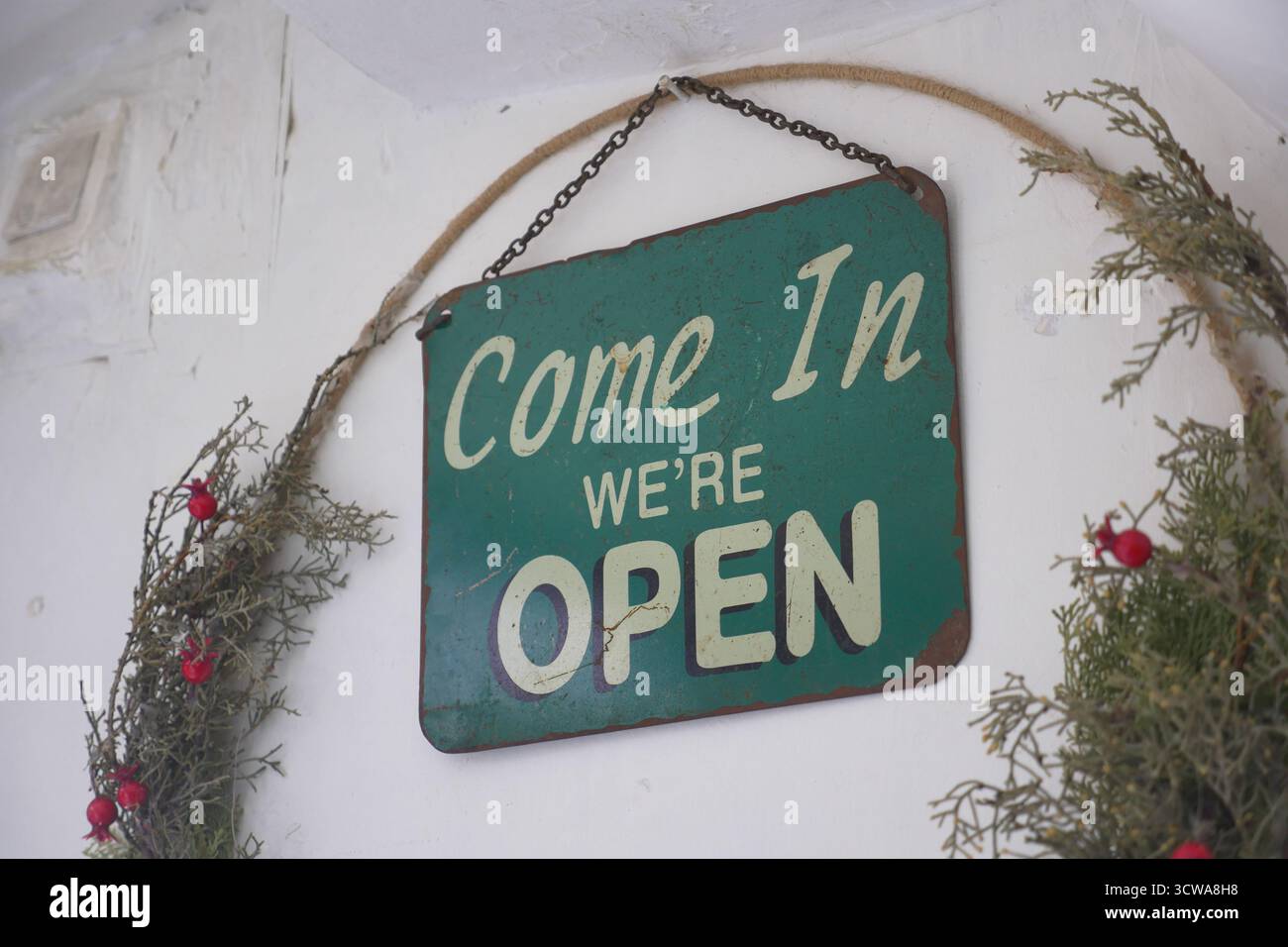 Open sign welcomes visitors hi-res stock photography and images - Alamy