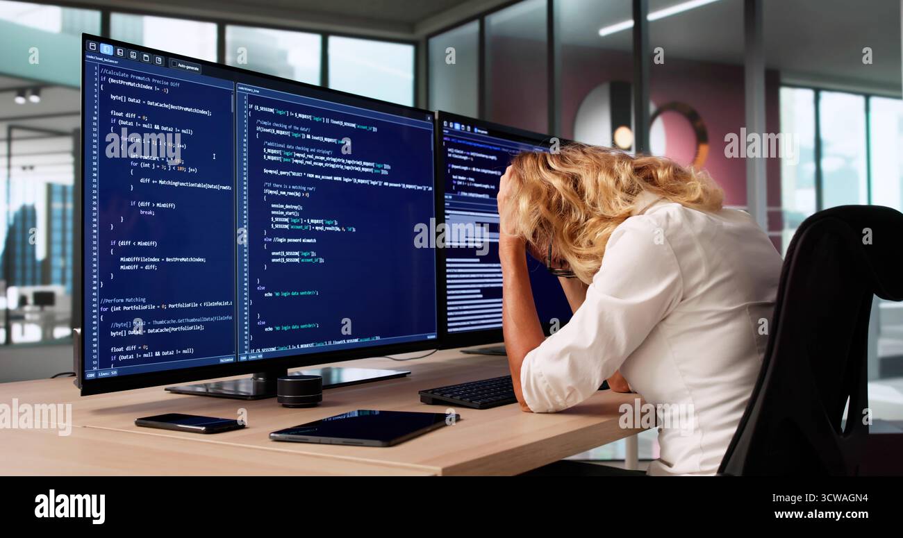 Bored Female Software Developer Web Programmer In Business Coding. Stock Photo