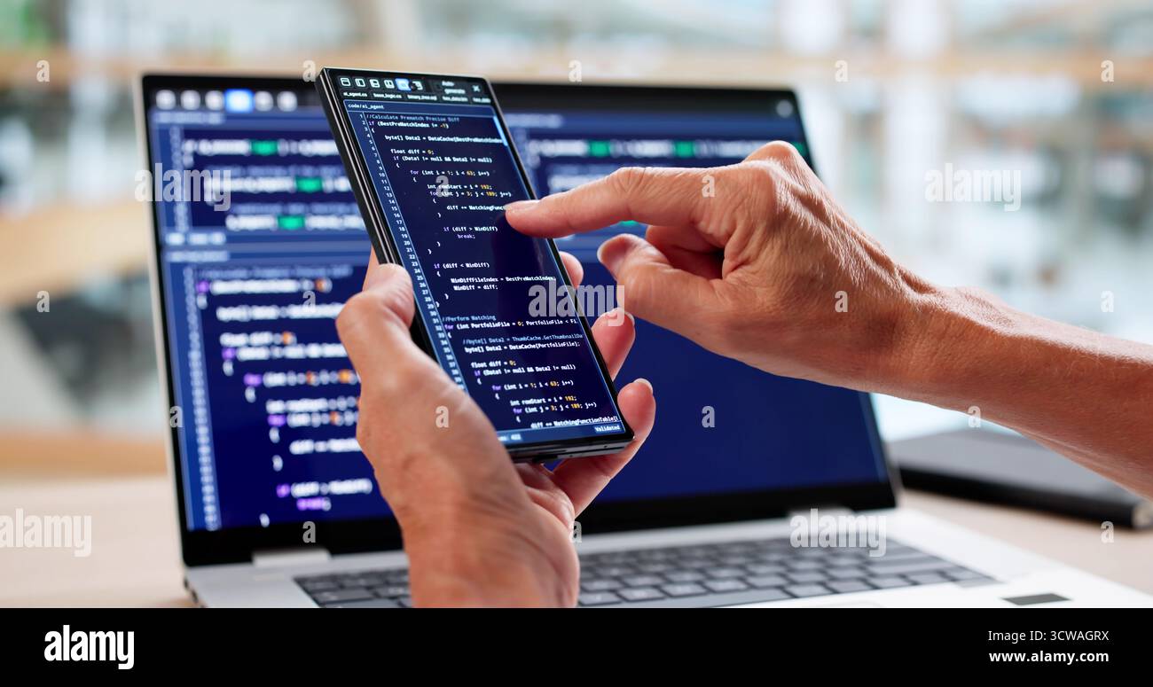Woman Coder Working On Web Development At Office Desk Stock Photo