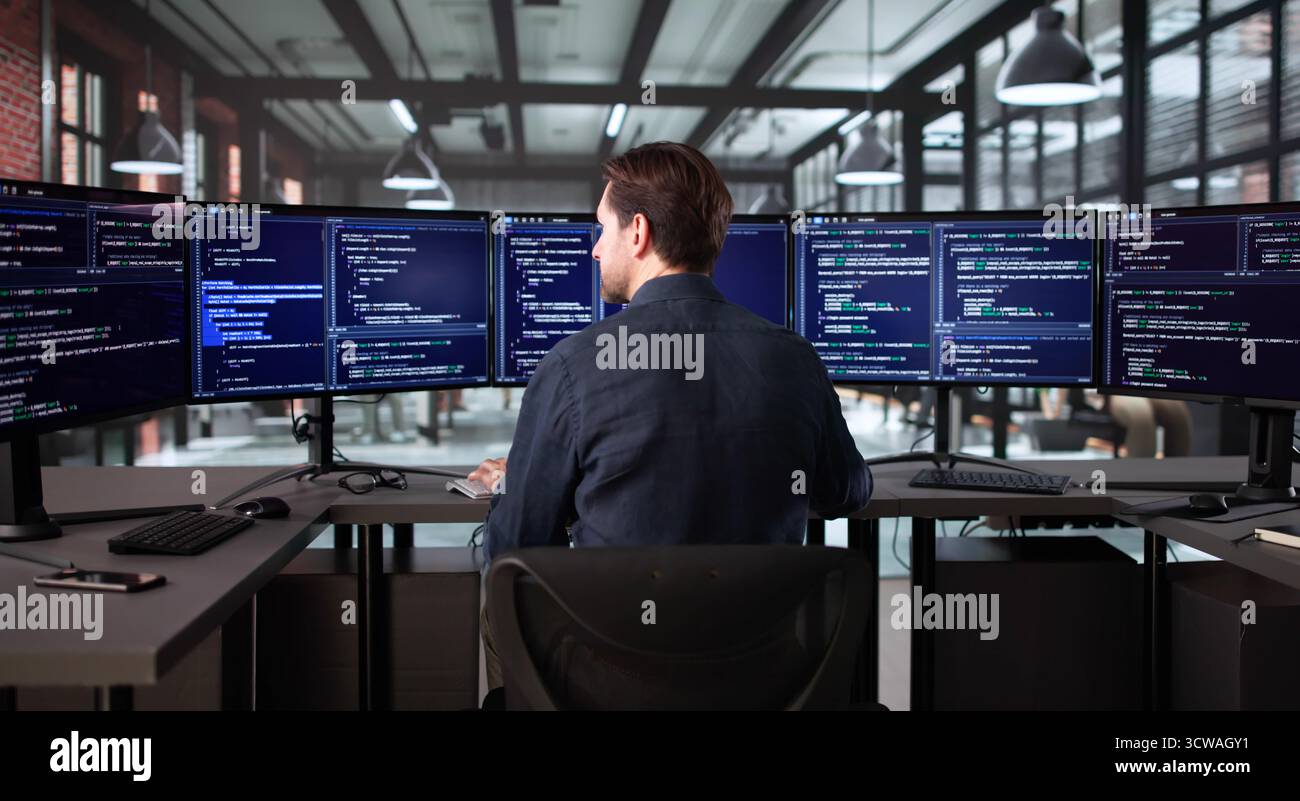 Senior Programmer Developing Cyber Security App On Office Computer Screen Stock Photo