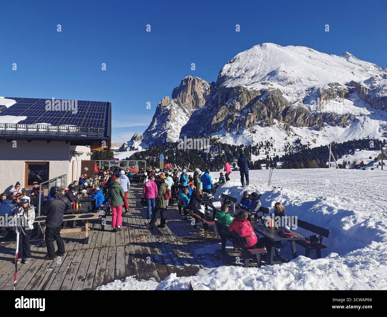 Williamshütte hut in snow on Alpe di Siusi (Seiser Alm), Dolomites, South Tyrol, Italy – ski season view with Sassolungo (Langkofel), alpine slopes. - Smartphone Captured Stock Image