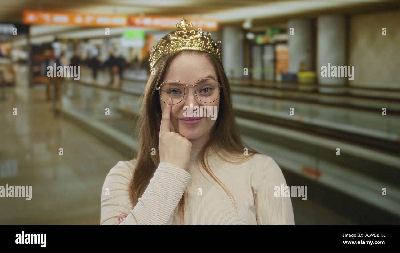 Woman wearing gold crown smiles hi-res stock photography and images - Alamy