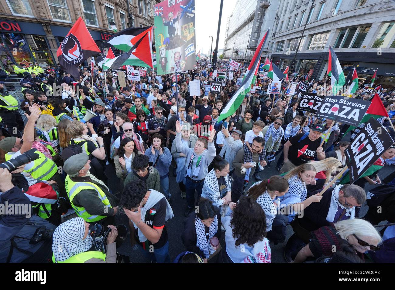 People take part in a Palestine Solidarity Campaign march in central ...