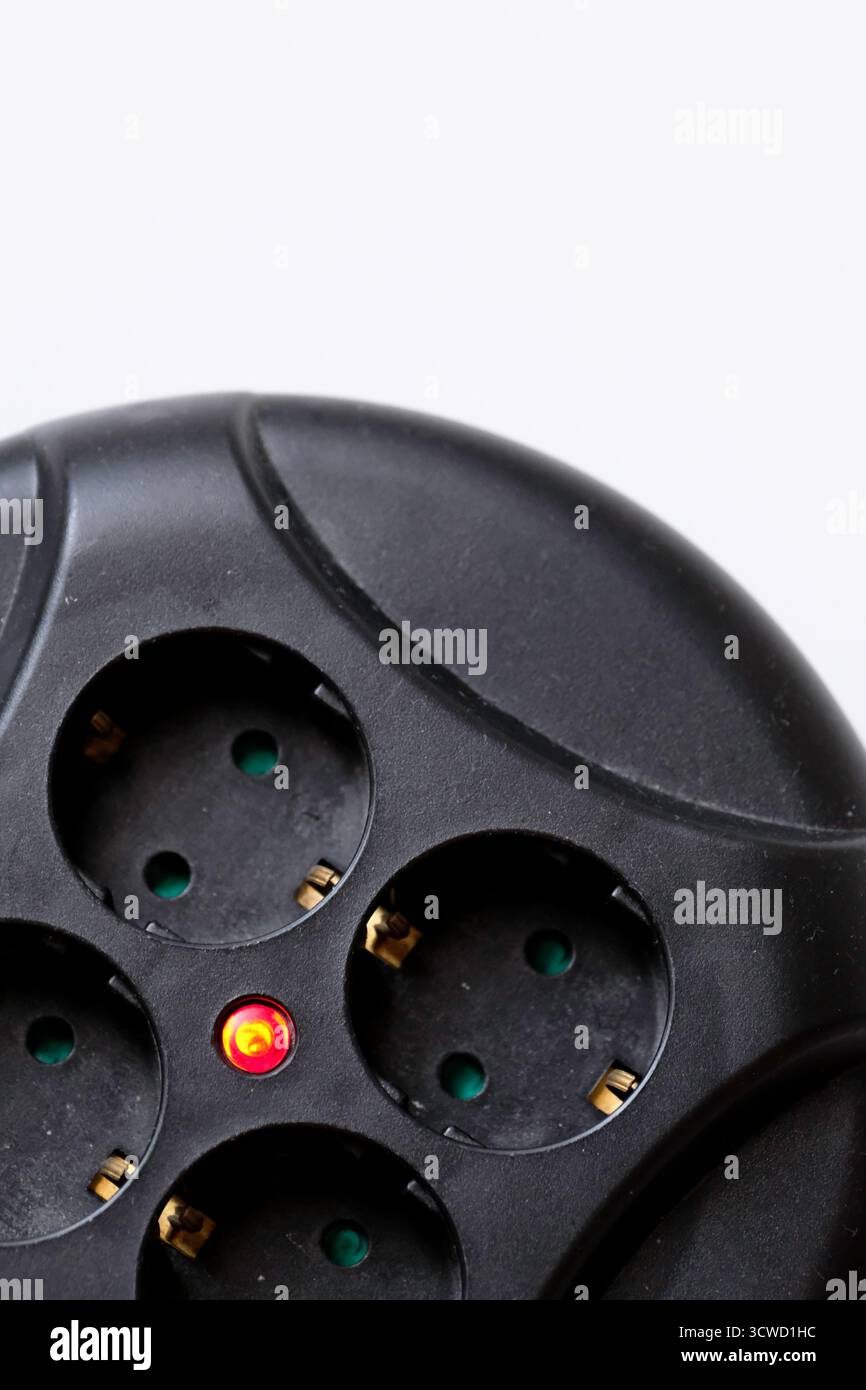 Rolled extension with a red light indicator signals Stock Photo