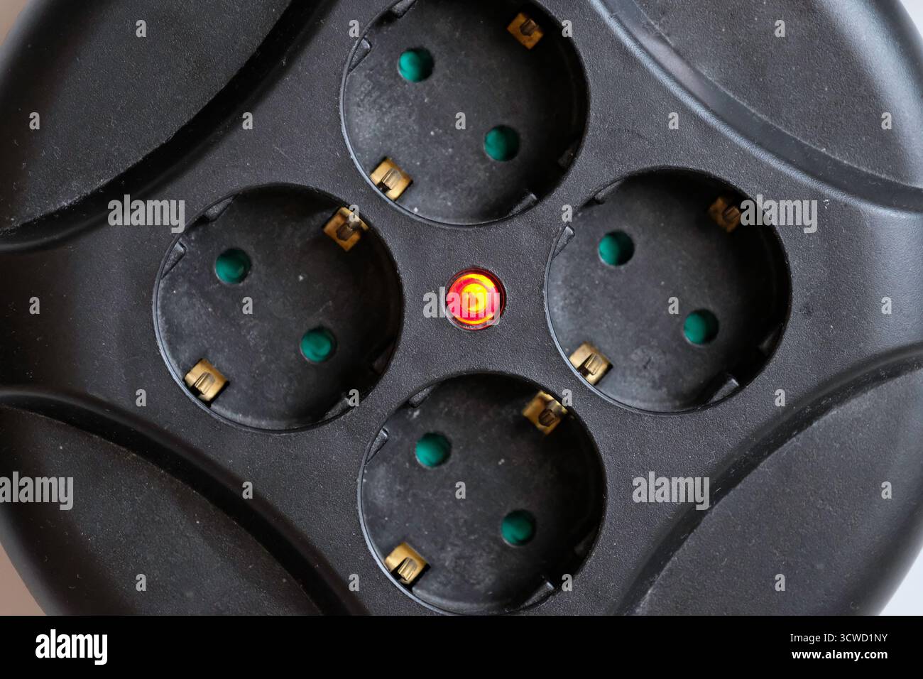 Rolled extension with a red light indicator signals Stock Photo