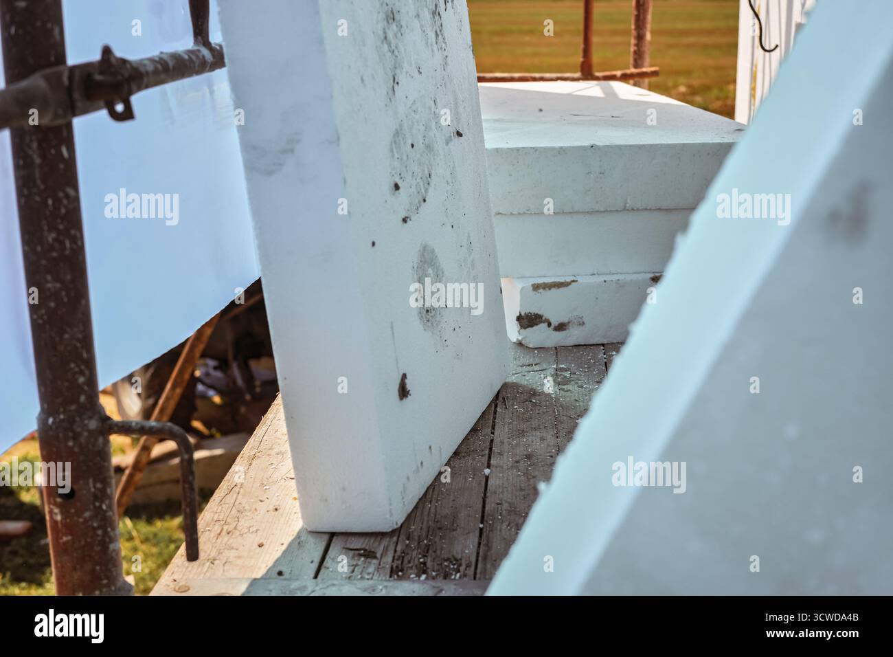 White polystyrene foam board blocks for heat insulation ready at construction site, closeup detail Stock Photo