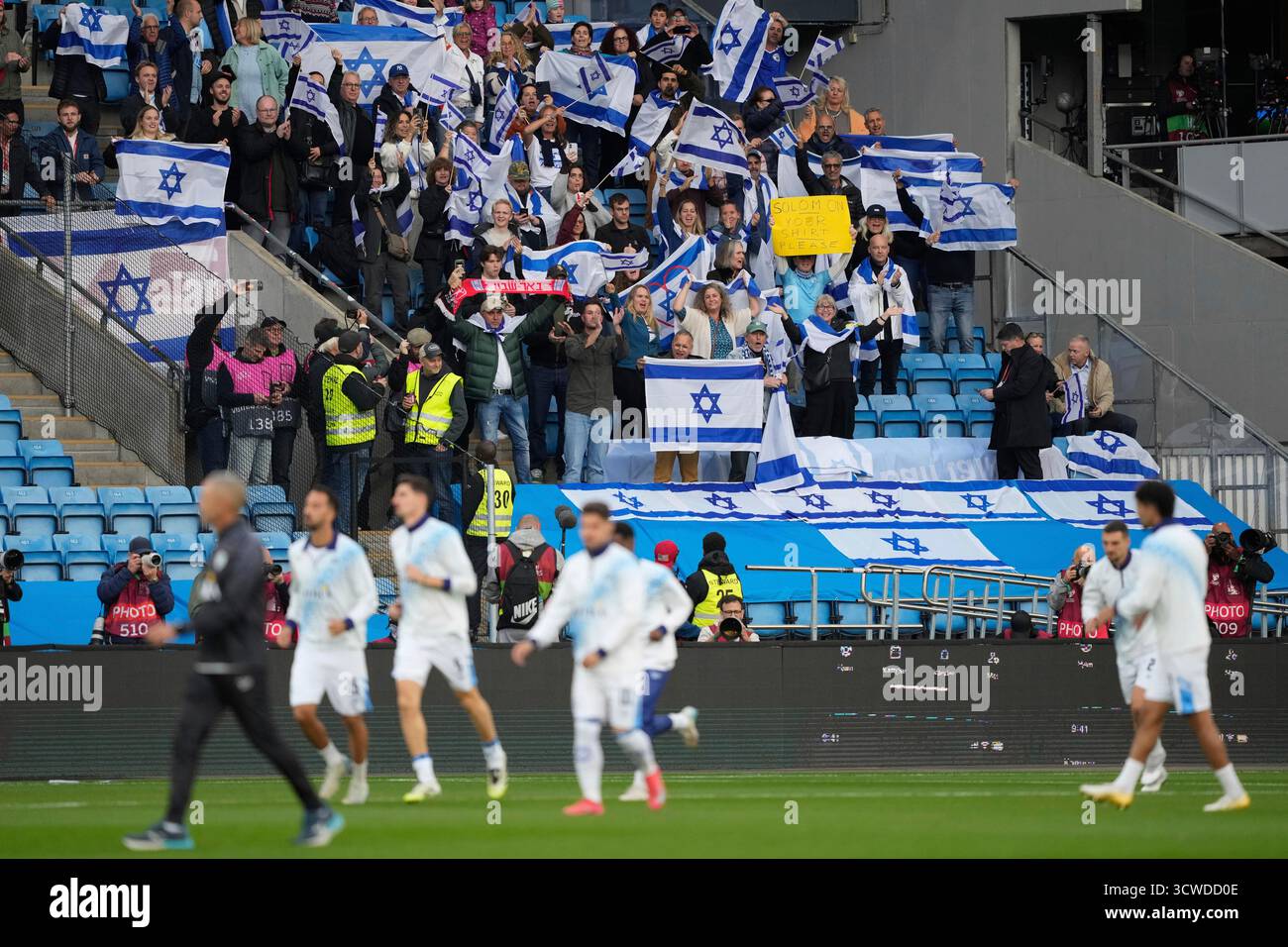 Matching Israel Israel's players warm up ahead of the World Cup qualifying soccer match ...