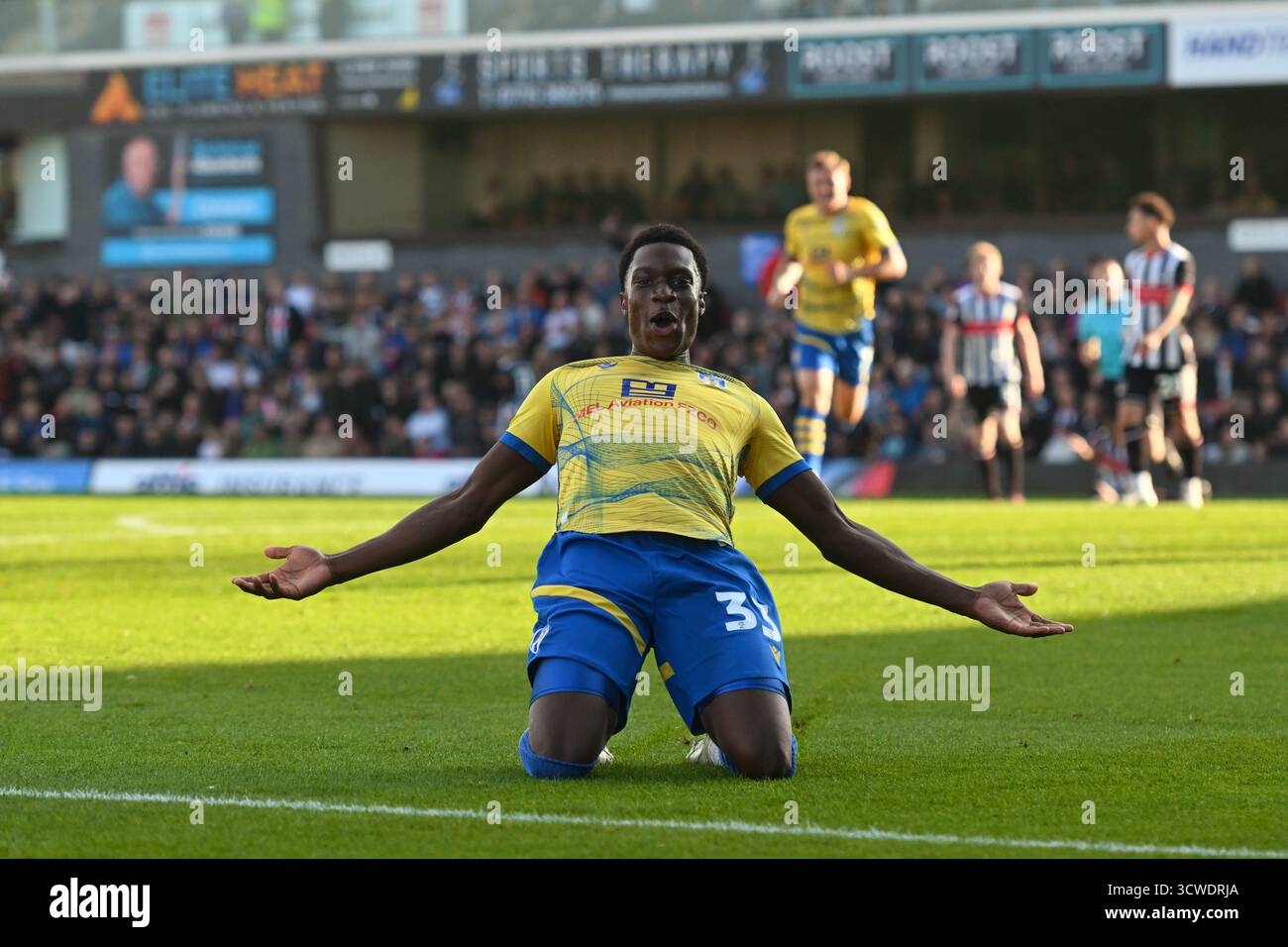 micah-mbick-of-colchester-united-celebrates-grimsby-town-v-colchester