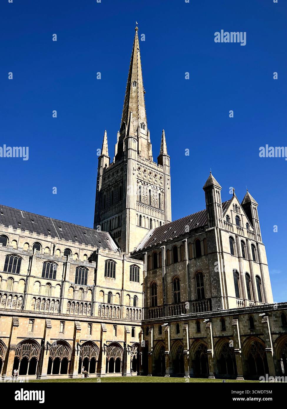 Norwich Cathedral, UK, photographed on a sunny spring day with a blue sky. - Smartphone Captured Stock Image