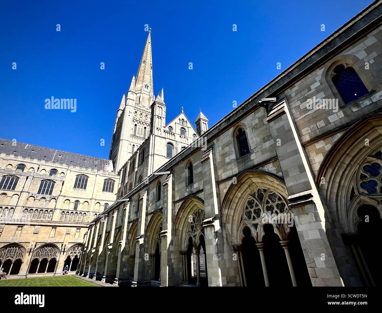 Norwich Cathedral, UK, photographed on a sunny spring day with a blue sky. - Smartphone Captured Stock Image