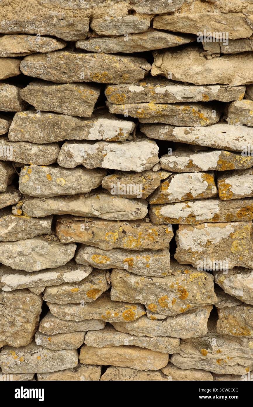 Stack Stone Patterns Stacked natural stones forming a traditional dry stone wall, displaying ...