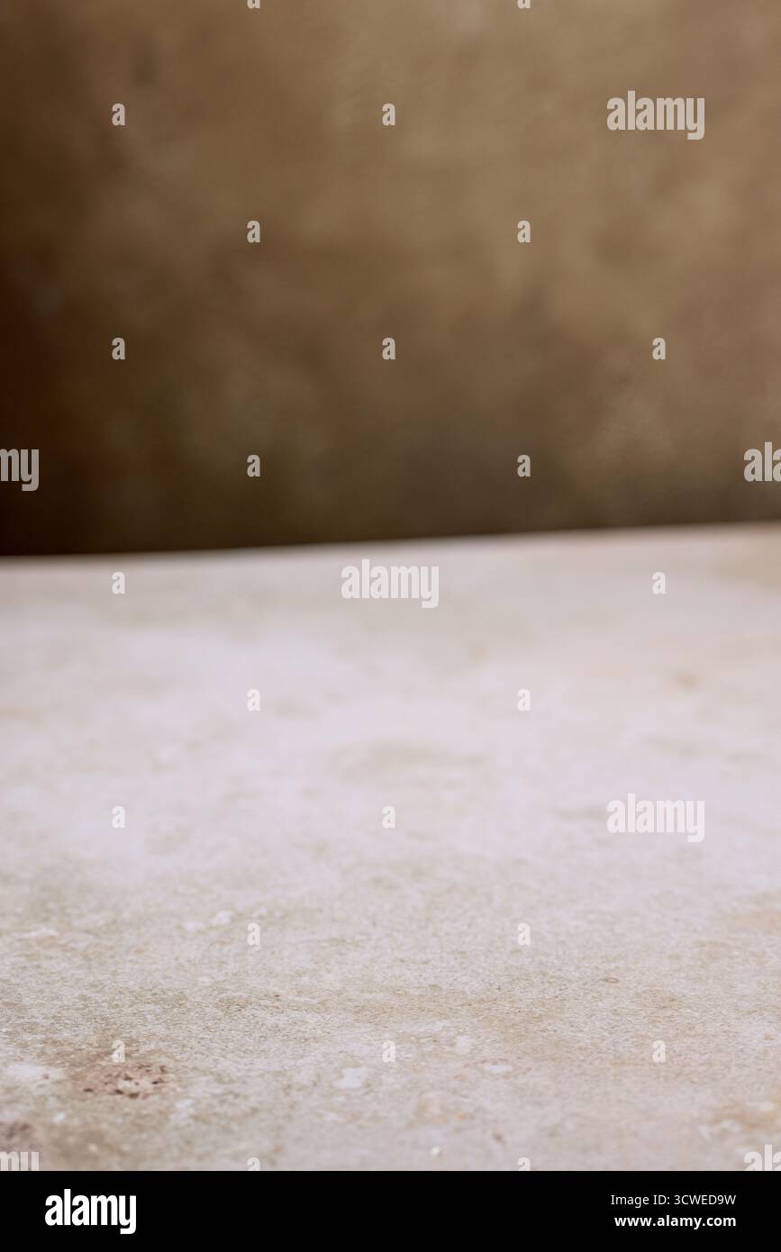 beige table texture and brown wall background Stock Photo