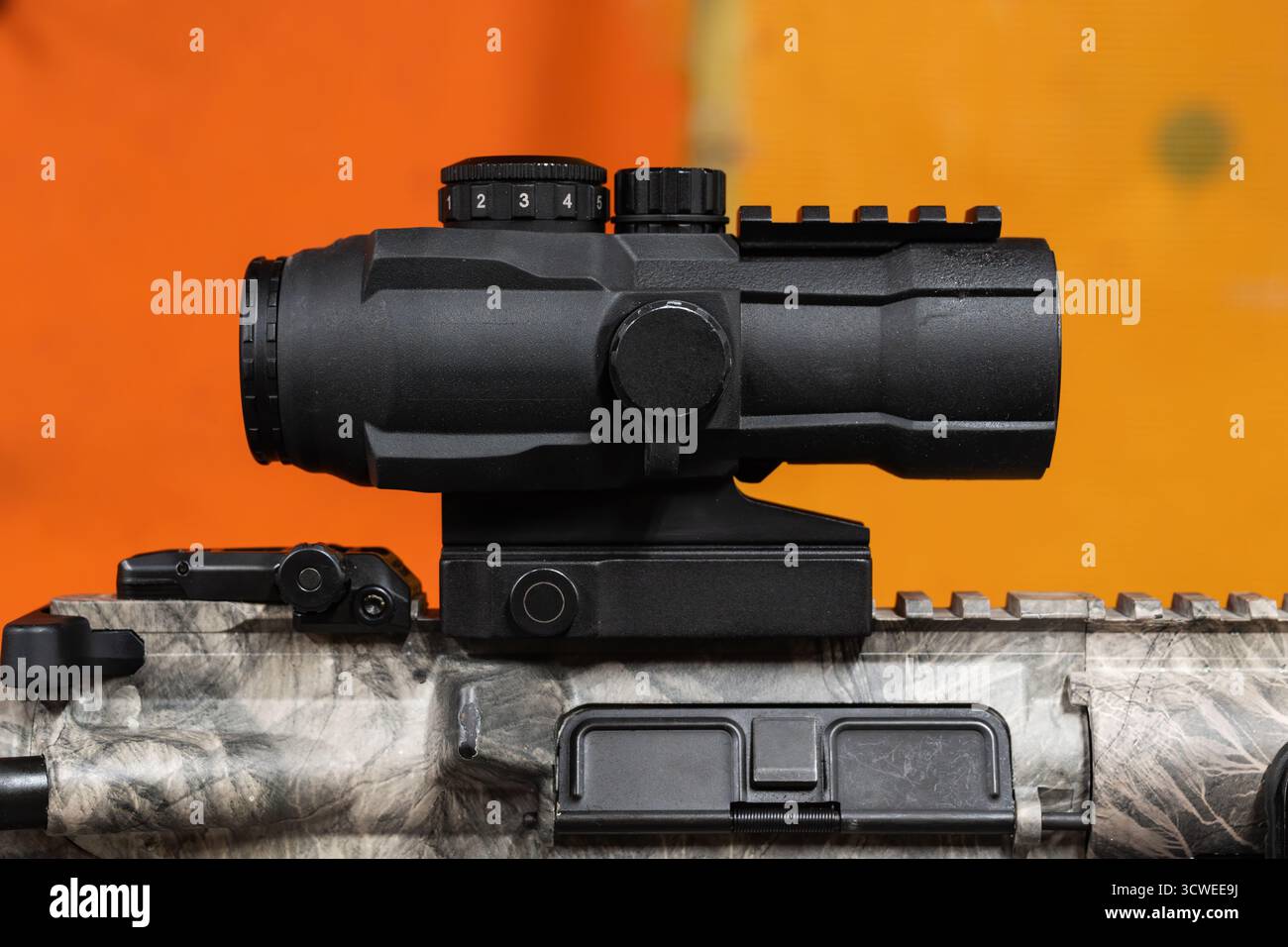 Modern black compact prismatic battle sight with tactical adjustment ...