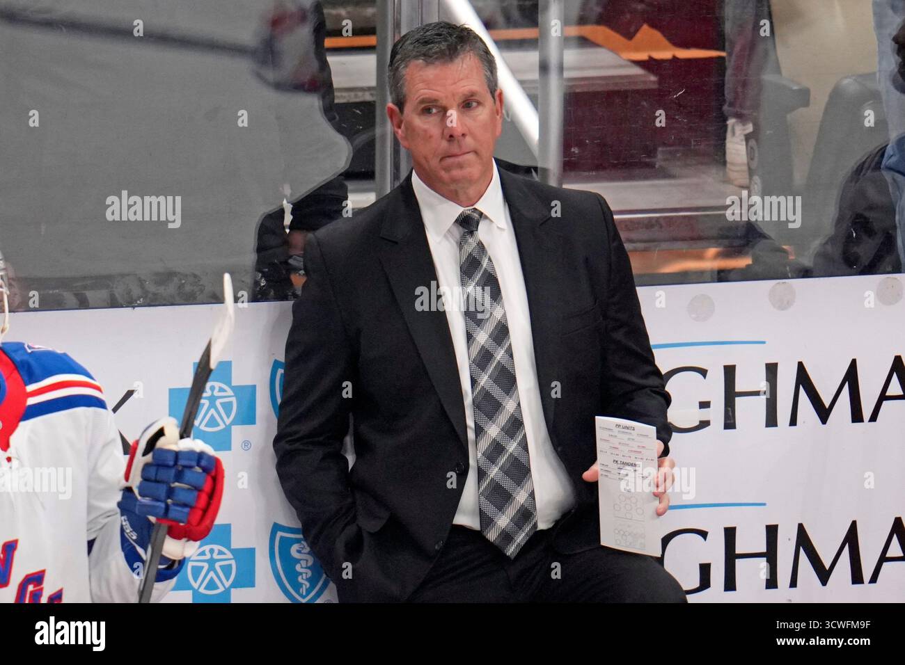 New York Rangers head coach Mike Sullivan stands behind his bench ...