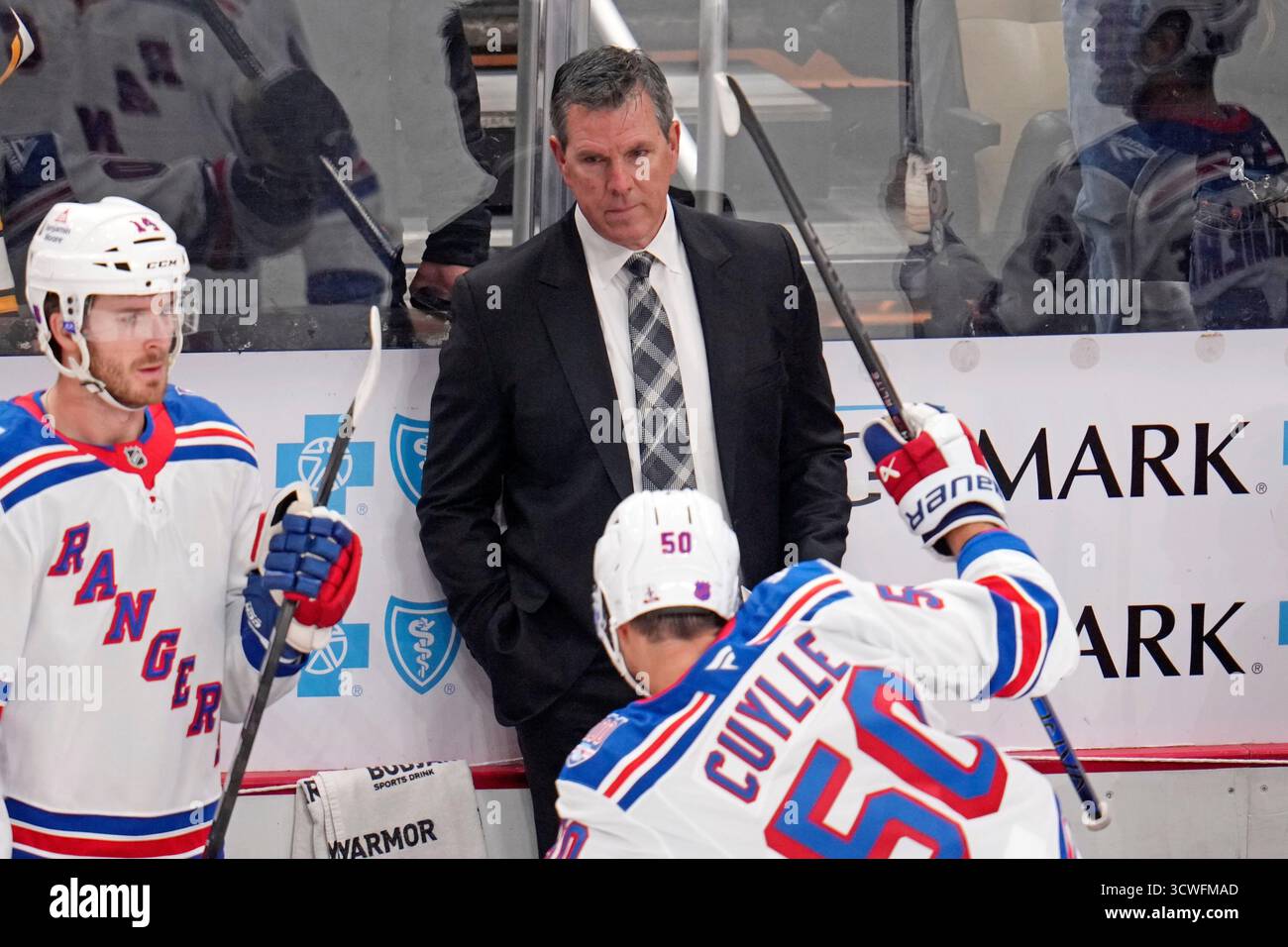 New York Rangers head coach Mike Sullivan stands behind his bench ...