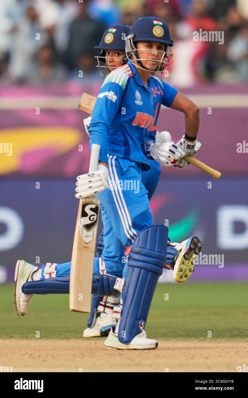 India's Smriti Mandhana, front, and batting partner Pratika Rawal run ...