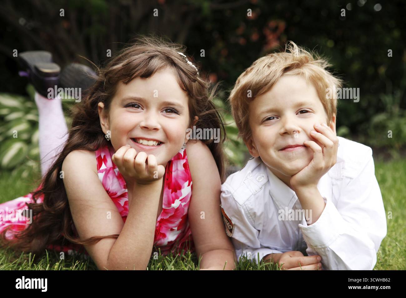 Brother and sister outdoors smiling Stock Photo - Alamy