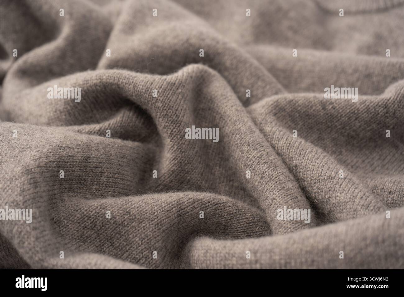 Soft grey merino wool sweater texture as a background. Top view. Stock Photo