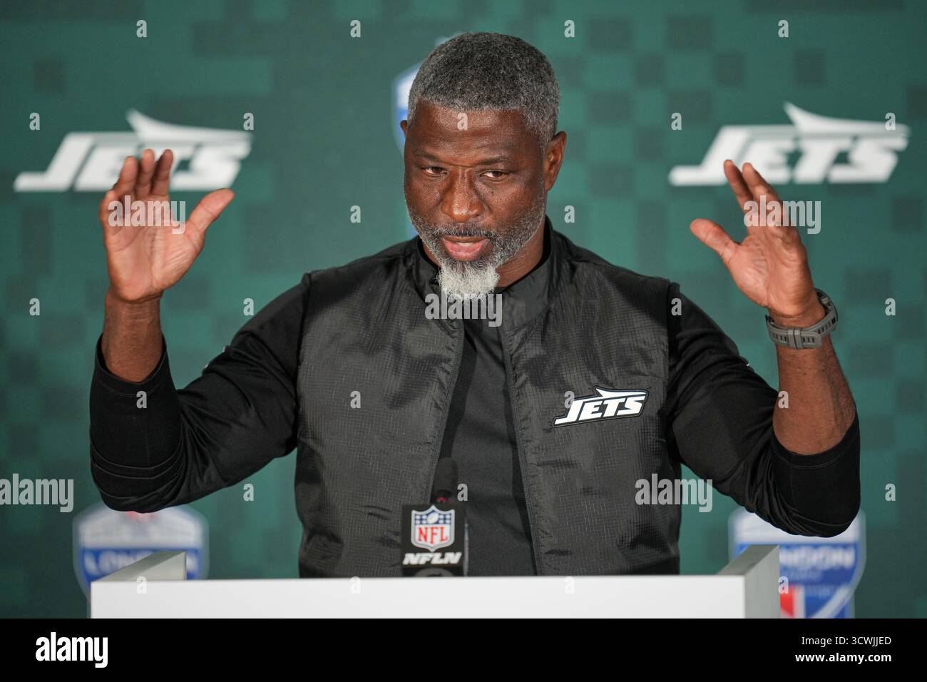 New York Jets head coach Aaron Glenn gestures during a press conference ...