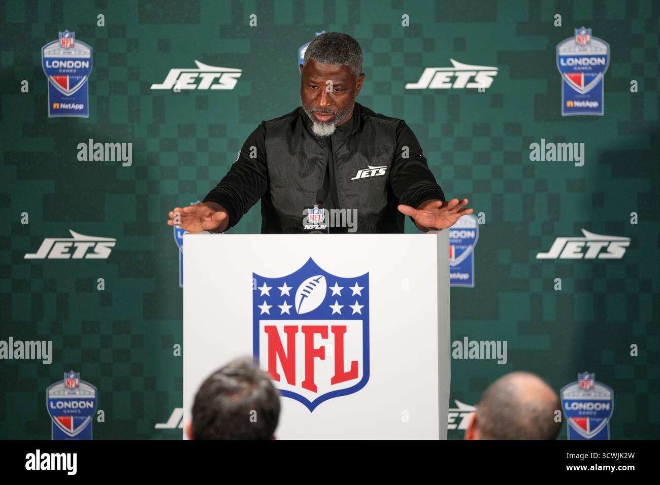 New York Jets head coach Aaron Glenn gestures during a press conference ...