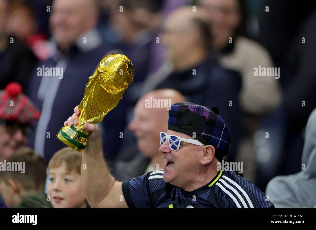 Scotland Fan With A World Cup Trophy In The Crowd During The FIFA World scotland-fan-with-a-world-cup-trophy-in-the-crowd-during-the-fifa-world