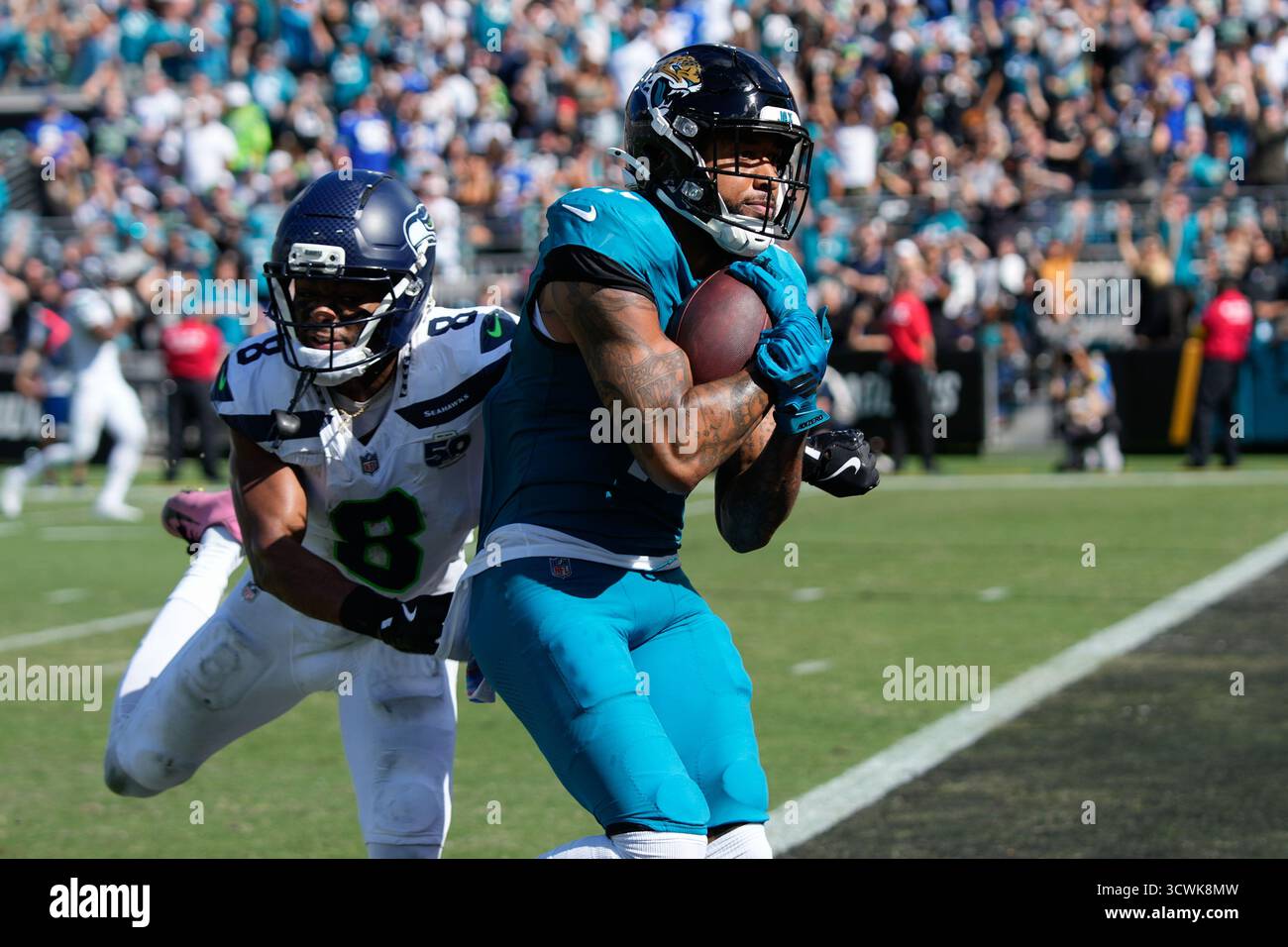 Jacksonville Jaguars wide receiver Tim Patrick (17) runs in a touchdown ...