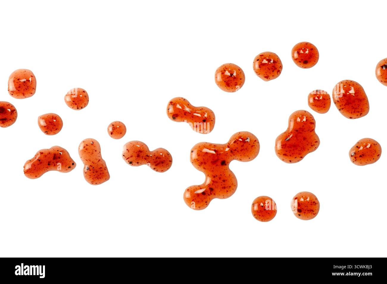 Red jam splashes isolated on a white background. Top view. Stock Photo
