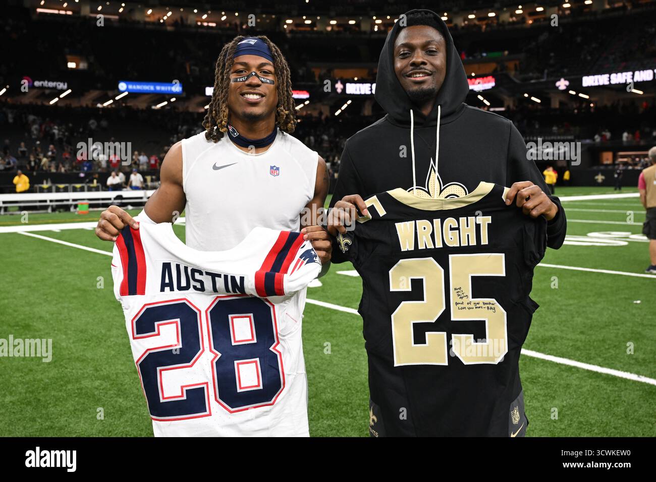 New England Patriots cornerback Alex Austin, left, and New Orleans ...