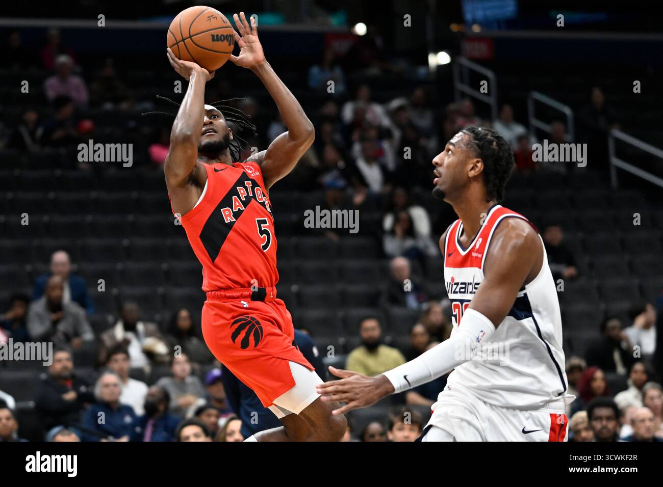 Toronto Raptors guard Immanuel Quickley (5) looks to shoot a basket ...