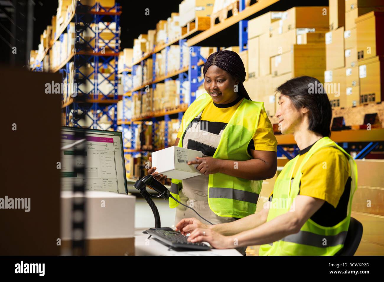Diverse staff tracking orders hi-res stock photography and images - Alamy