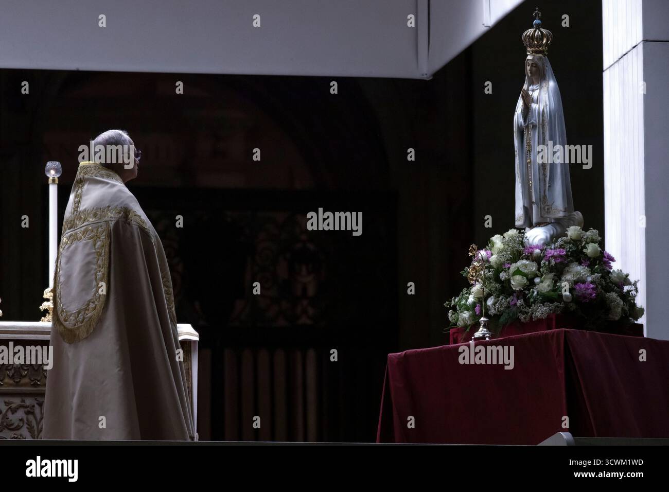 Pope Leo XIV prays in front of the statue of Our Lady of Fatima as he ...