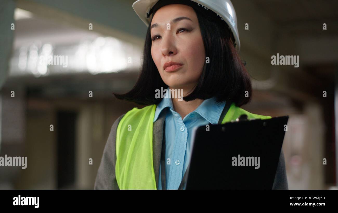Korean Japanese woman builder thinking Asian Chinese female writing ...