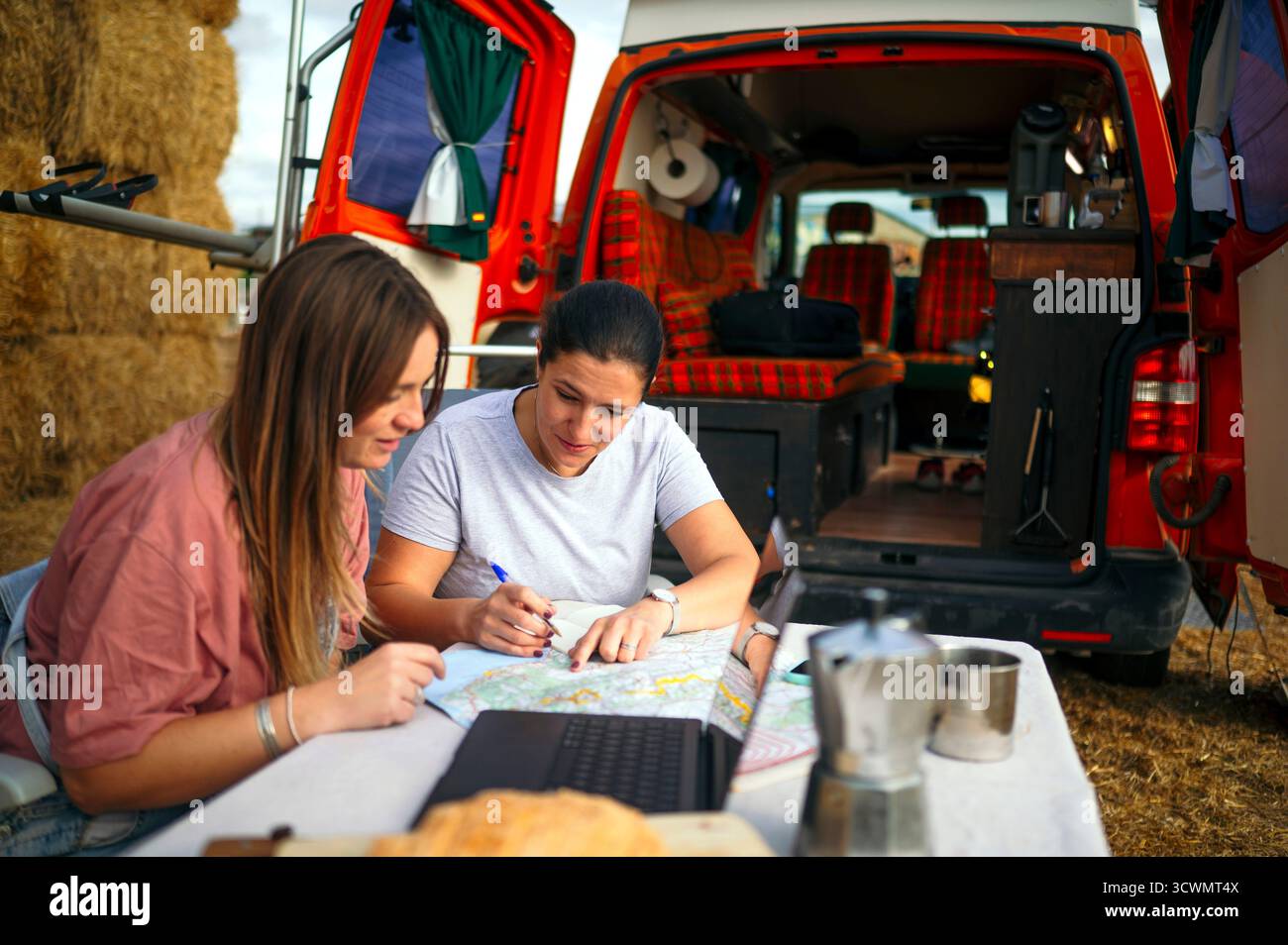 Women planning route map hi-res stock photography and images - Alamy