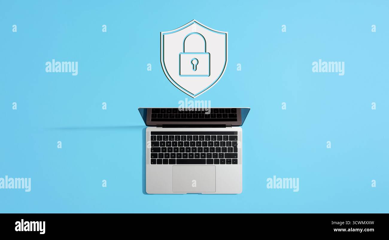 White shield and padlock icon hovering over laptop computer symbolizing online security and data protection Stock Photo