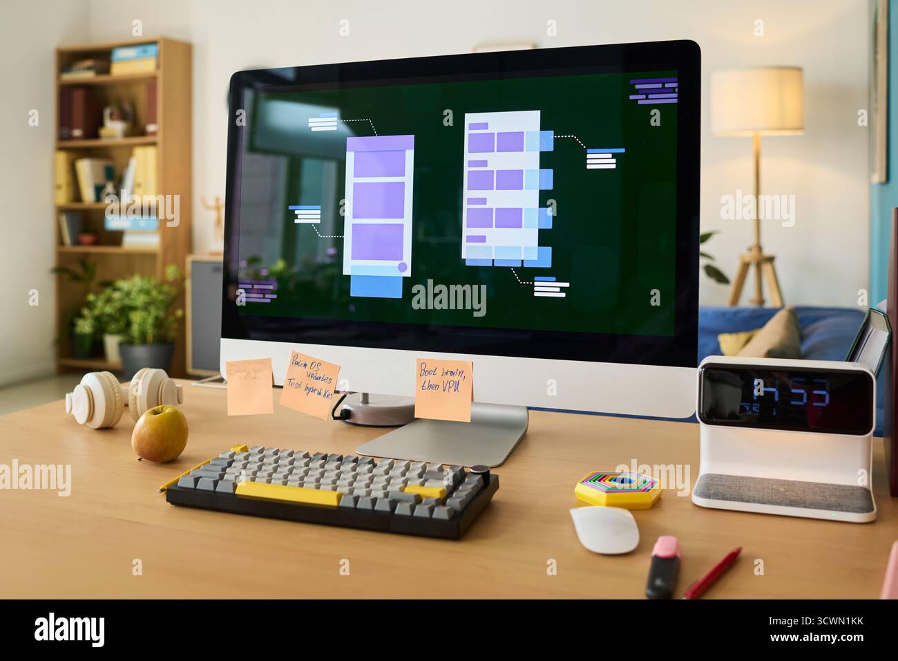 Modern Workspace Featuring Desktop Computer Displaying Mobile App Wireframes Stock Photo