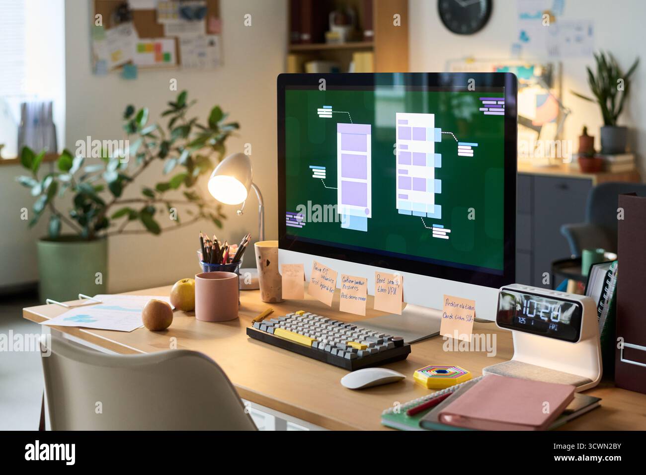 Modern Workspace Featuring Desktop Computer Displaying User Interface Design Stock Photo