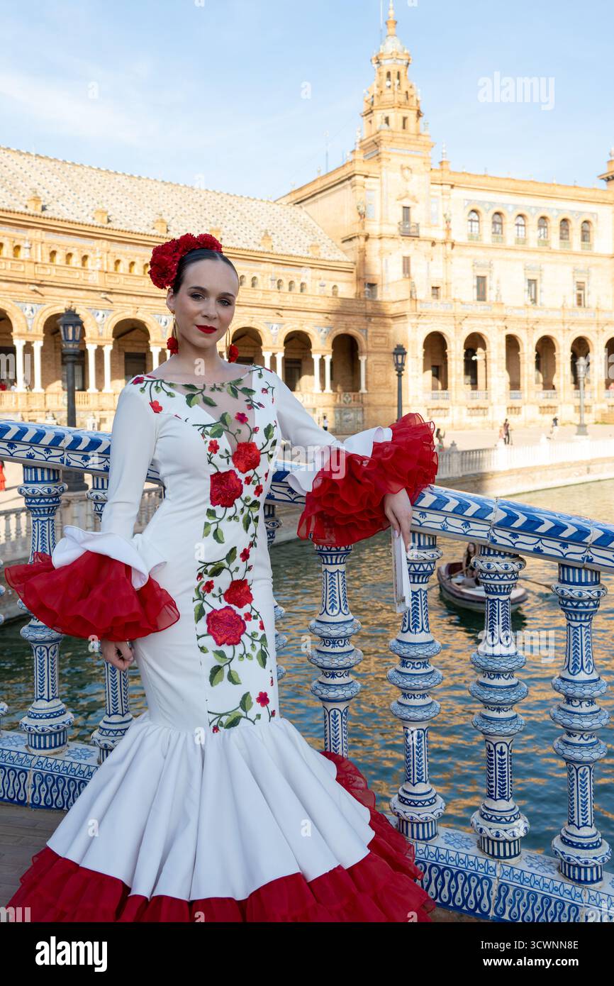 Sevilla, Spain - 23 Apr 23: A woman in a traditional flamenco dress with red ruffles and floral embroidery, posing on a bridge by a river with histori Stock Photo - Alamy Sevilla, Spain - 23 Apr 23: A woman in a traditional flamenco dress with red ruffles and floral embroidery, posing on a bridge by a river with histori Stock Photo - Alamy