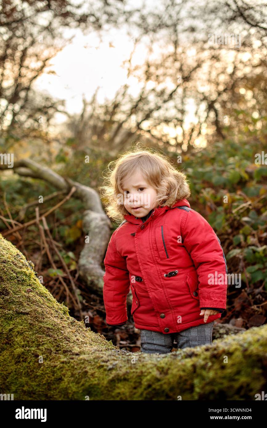 Child in red jacket hi-res stock photography and images - Alamy