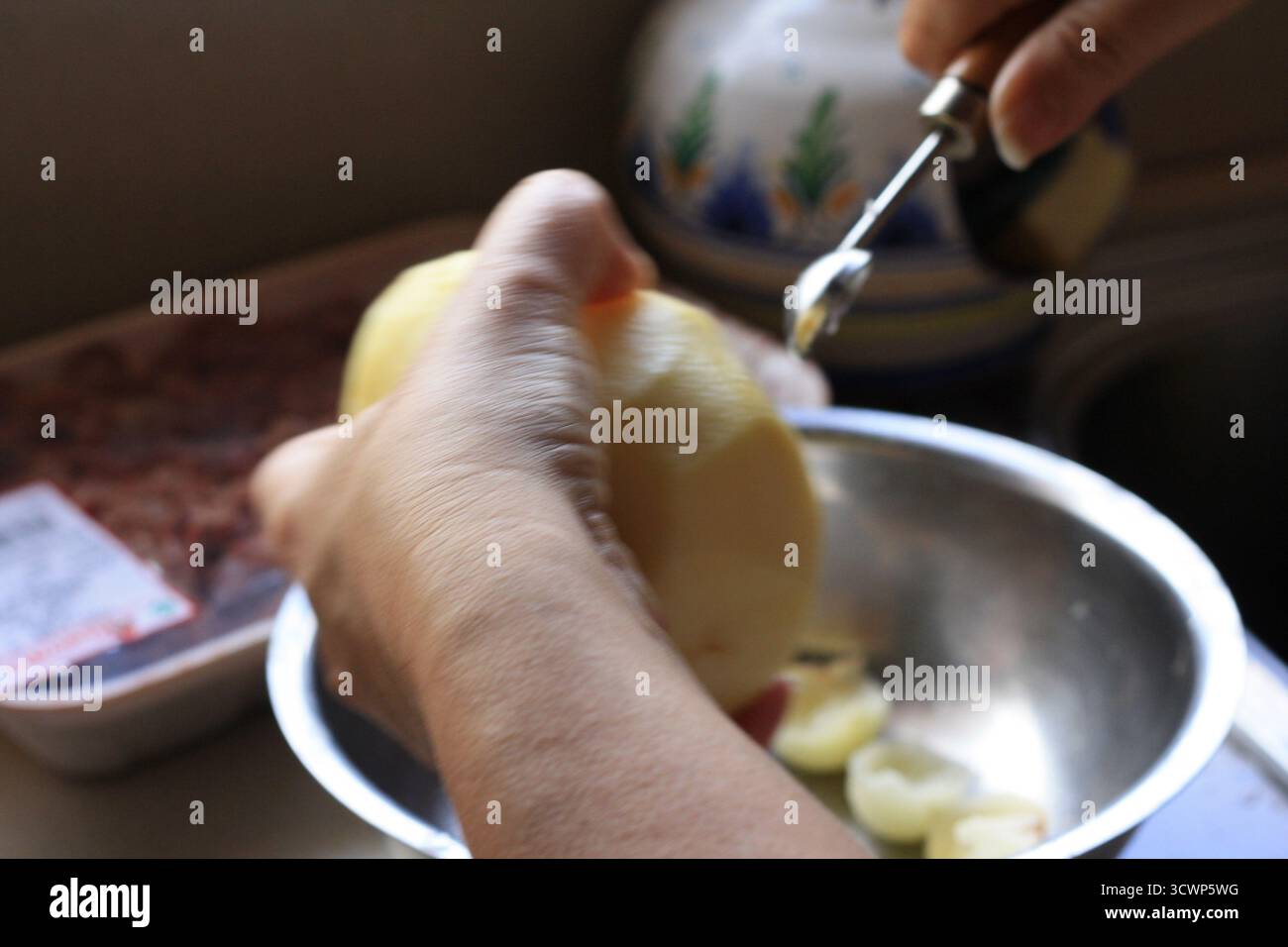 peeling potatoes Stock Photo