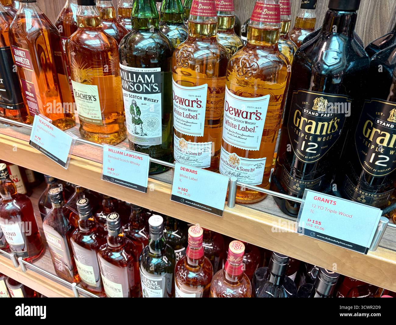 Dubai airport duty free terminal 3, selection of scotch whisky from Dewars, Grant's and Teachers available for sale, United Arab Emirates - Smartphone Captured Stock Image