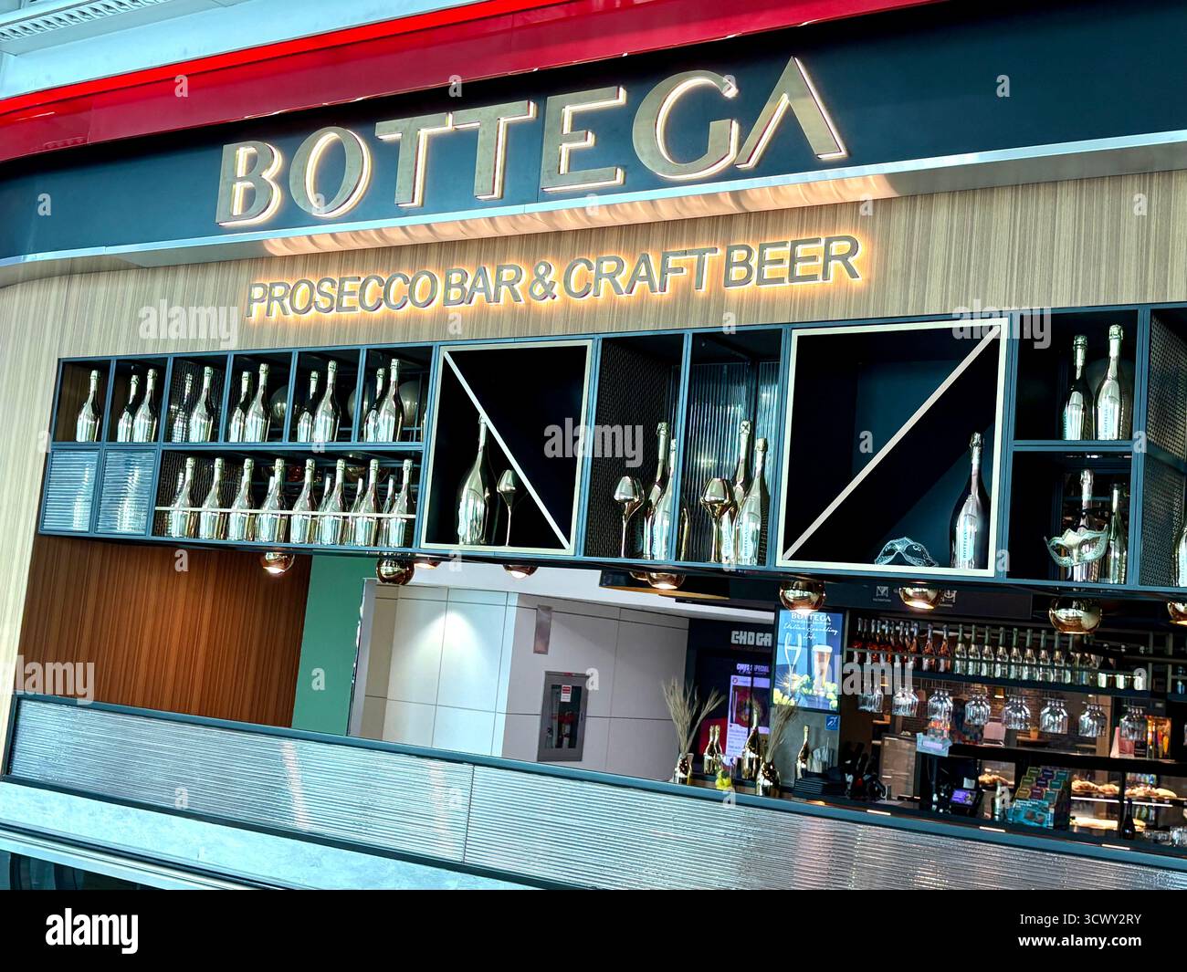 Dubai international airport, Bottega prosecco bar and beer restaurant diner inside terminal 3 - Smartphone Captured Stock Image