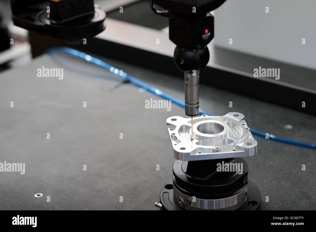 Quality control test of CNC milling process by coordinate measuring machine. Selective focus. Stock Photo