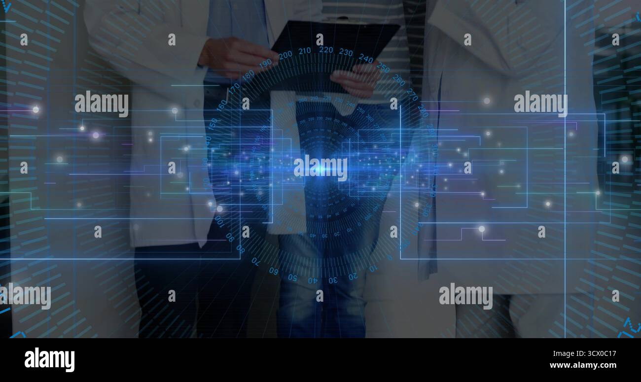Three professionals wearing lab coats analyzing holographic interface in lab, with tablet device Stock Photo